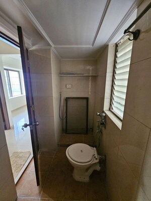 Bathroom in 2 BHK Apartment at Marathon Cosmos, Mulund West – for Rent