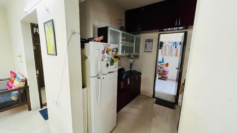 Kitchen, goyal-my-home-mh-14 2.5 Bedroom 870 Sq.Ft. Apartment In Punawale Pune 10258376