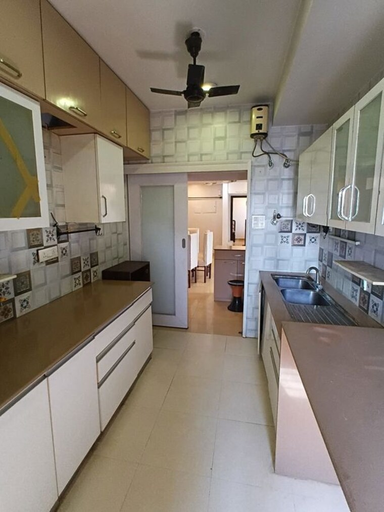 Kitchen, lokhandwala-whispering-palms-xxclusives 3 Bedroom 1200 Sq.Ft. Apartment In Kandivali East Mumbai 10258576