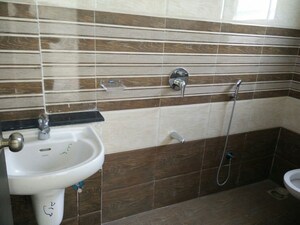 Bathroom in 2 BHK Apartment at Vyas Anudatta CHS, Rambaug Colony – for Rent