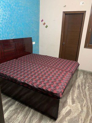 Bedroom in 3 BHK Builder Floor at Guru Nanak Enclave, Dhakoli – for Rent