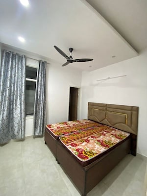 Bedroom in 3 BHK Builder Floor at Motia Blue Ridge, Dhakoli – for Rent