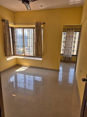 Bedroom in 2 BHK Apartment at Runwal Garden City, Balkum Pada – for Rent