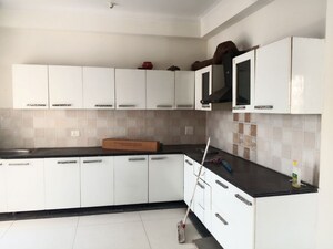 Kitchen in 4 BHK Apartment at Aarza Square 1, Sector 4 Greater Noida – for Rent