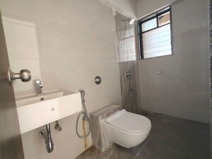 Bathroom in 2 BHK Apartment at Colorplus Raymond Realty Phase I, Pokhran Road No Two – for Rent