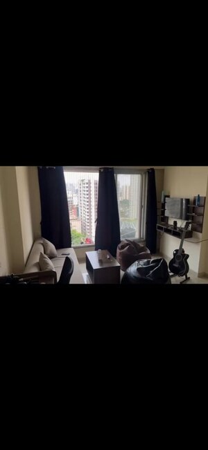 Living Room in 1 BHK Apartment at Ruparel Elara, Kandivali West – for Rent