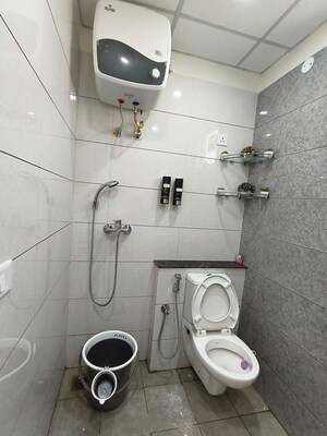 Bathroom in 3 BHK Apartment at Affinity Greens, International Airport Road – for Rent
