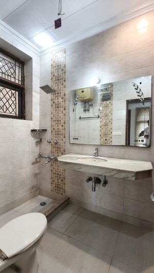 Bathroom in 4 BHK Apartment at Panchsheel Enclave – for Rent