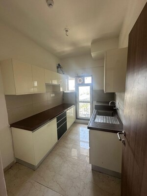 Kitchen in 2 BHK Apartment at Shapoorji Pallonji Alpine 2, Kandivali East – for Rent