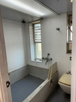 Bathroom in 1 BHK Apartment at Raheja Twp – for Sale