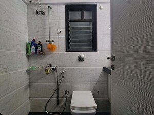 Bathroom in 2 BHK Apartment at Raunak Sai Dham Towers, Kandivali West – for Rent