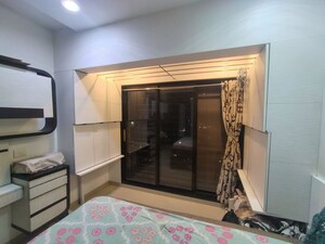Bedroom in 2 BHK Apartment at Raunak Sai Dham Towers, Kandivali West – for Rent