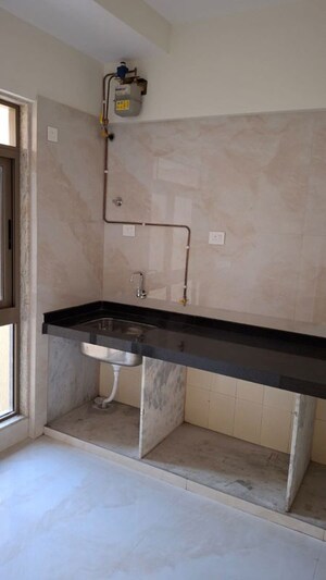 Kitchen in 3 BHK Apartment at Bhutra Mangal Karini Sky Breeze, Goregaon West – for Rent