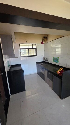 Kitchen in 2 BHK Apartment at Global Serenity, Moshi – for Rent