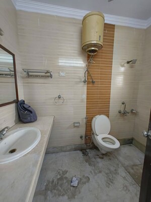 Bathroom in 4 BHK Builder Floor at Kalkaji – for Rent