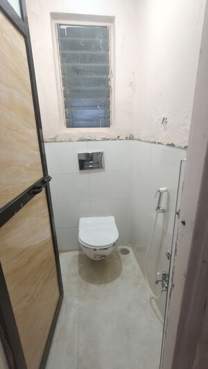 Bathroom in 1 BHK Apartment at Shalmali Cooperative Housing Society, Vasant Vihar – for Rent