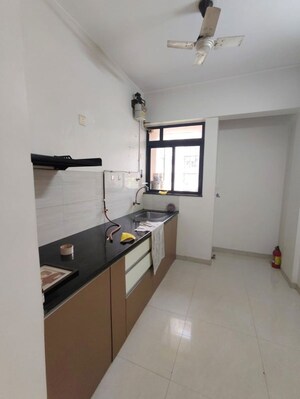 Kitchen in 1 BHK Apartment at Puranik Hometown, Ghodbunder Road – for Rent