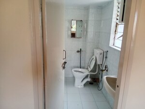 Bathroom in 2 BHK Apartment at Riddhi Enclave Co-op Housing Society Ltd, Viman Nagar – for Rent