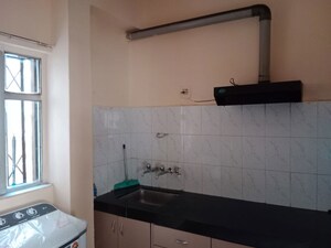 Kitchen in 2 BHK Apartment at Riddhi Enclave Co-op Housing Society Ltd, Viman Nagar – for Rent