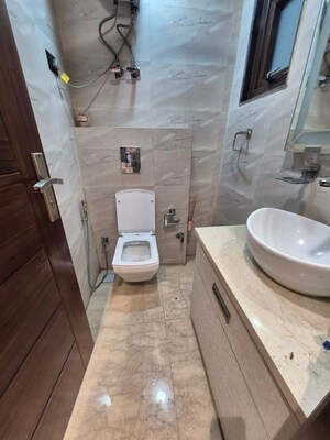 Bathroom in 3.5 BHK Apartment at Kailash Colony – for Rent