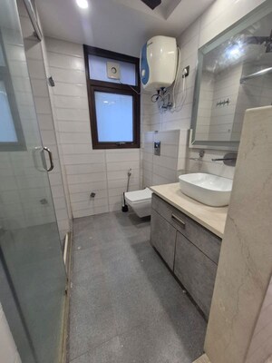 Bathroom in 3.5 BHK Apartment at Kailash Colony – for Rent