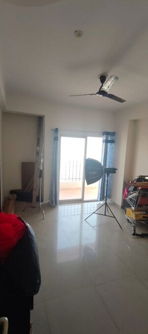 Living Room in 2 BHK Apartment at Mahagun My Woods, Sector 16c Greater Noida – for Rent