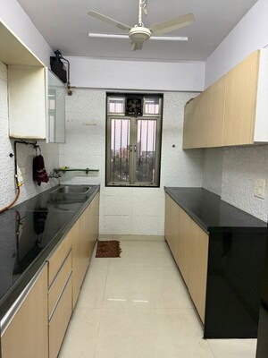 Kitchen in 3 BHK Apartment at Woodland Crest Apartment, Andheri East – for Sale