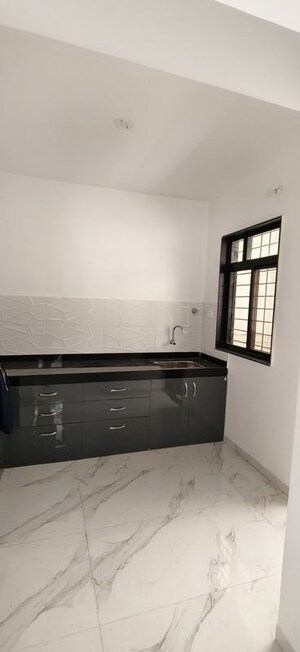 Kitchen in 2 BHK Apartment at Wadgaon Sheri – for Rent
