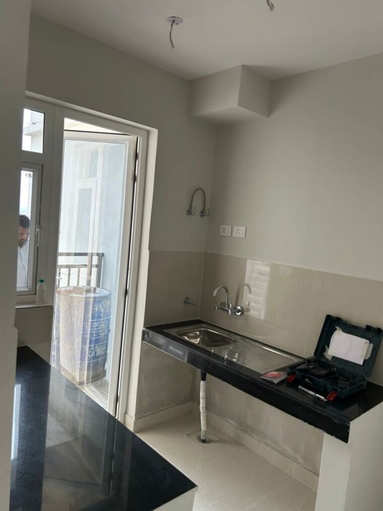 Kitchen, eldeco-live-by-the-greens 2 Bedroom 1155 Sq.Ft. Apartment In Sector 150 Noida 10273947