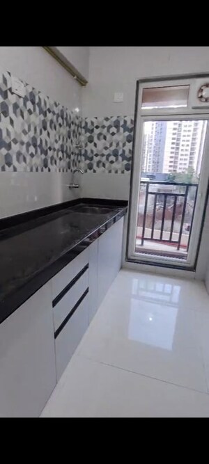 Kitchen in 1 BHK Apartment at Raunak Bliss, Ghodbunder Road – for Rent