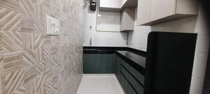 Kitchen in 1 BHK Apartment at Rushabh Arihant CHS, Andheri West – for Sale
