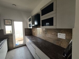 Kitchen in 3.5 BHK Apartment at Elite Golf Green, Sector 79 – for Rent