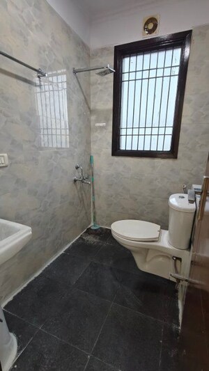 Bathroom in 2 BHK Builder Floor at Chattarpur – for Rent
