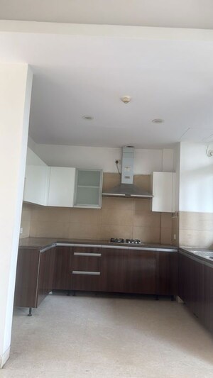 Kitchen in 3.5 BHK Apartment at Puri Diplomatic Greens Phase I, Sector 111 – for Rent