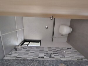 Bathroom in 2 BHK Apartment at Kohinoor Courtyard One, Wakad – for Rent