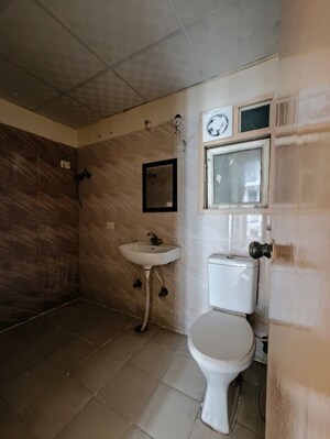 Bathroom in 3 BHK Apartment at Antriksh Golf View, Sector 78 – for Rent