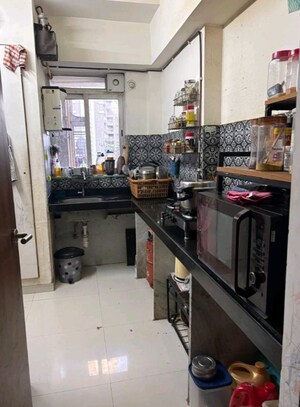 Kitchen in 1.5 BHK Apartment at Lodha Amara, Kolshet Road – for Sale
