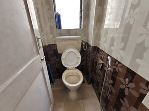 Bathroom in 1 BHK Apartment at Himgiri Lokupvan Phase II CHS Ltd, Vasant Vihar – for Rent