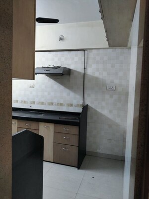 Kitchen in 3 BHK Apartment at Harasiddh Riddhi Tower, Malad East – for Rent