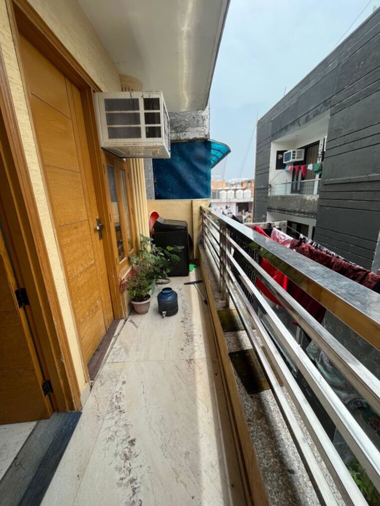 Balcony, rajpur khurd extension 2 Bedroom 70 Sq.Yd. Apartment In Rajpur Khurd Extension Delhi 10277033