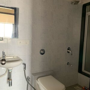 Bathroom in 2 BHK Apartment at Paradigm Ananda Residency, Babhai Naka – for Rent
