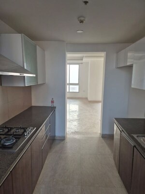 Kitchen in 3.5 BHK Apartment at Puri Diplomatic Greens Phase I, Sector 111 – for Sale