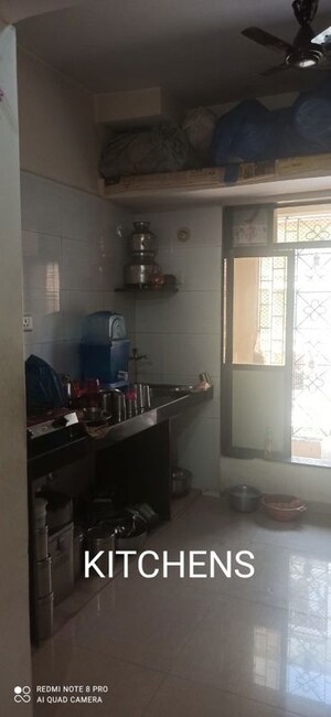 Kitchen in 3 BHK Apartment at Shreenathji CHS, Kandivali West – for Sale