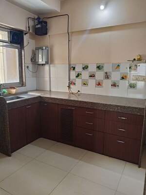 Kitchen in 2 BHK Apartment at Kanakia Spaces Niharika, Manpada – for Rent