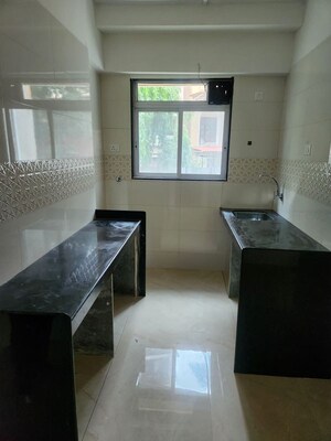 Kitchen in 2 BHK Apartment at Ssakash Shri Upendra Nagar CHSL, Dahisar East – for Sale