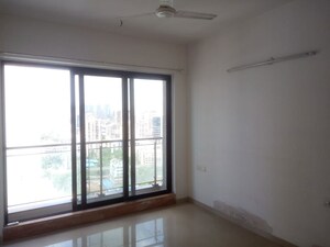 Master Bedroom in 2 BHK Apartment at Rustomjee Elanza, Malad West – for Rent