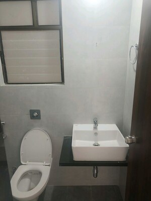 Bathroom in 2 BHK Apartment at Roshan Milestone, Tathawade – for Rent