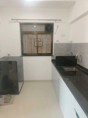 Kitchen in 2 BHK Apartment at Roshan Milestone, Tathawade – for Rent