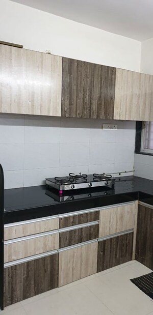 Kitchen in 2 BHK Apartment at Mahalaxmi Nagar CHS, Warje – for Rent