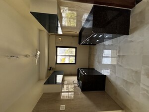 Kitchen in 2 BHK Apartment at Aasamanta Sandesh CHS, Jay Prakash Nagar – for Rent